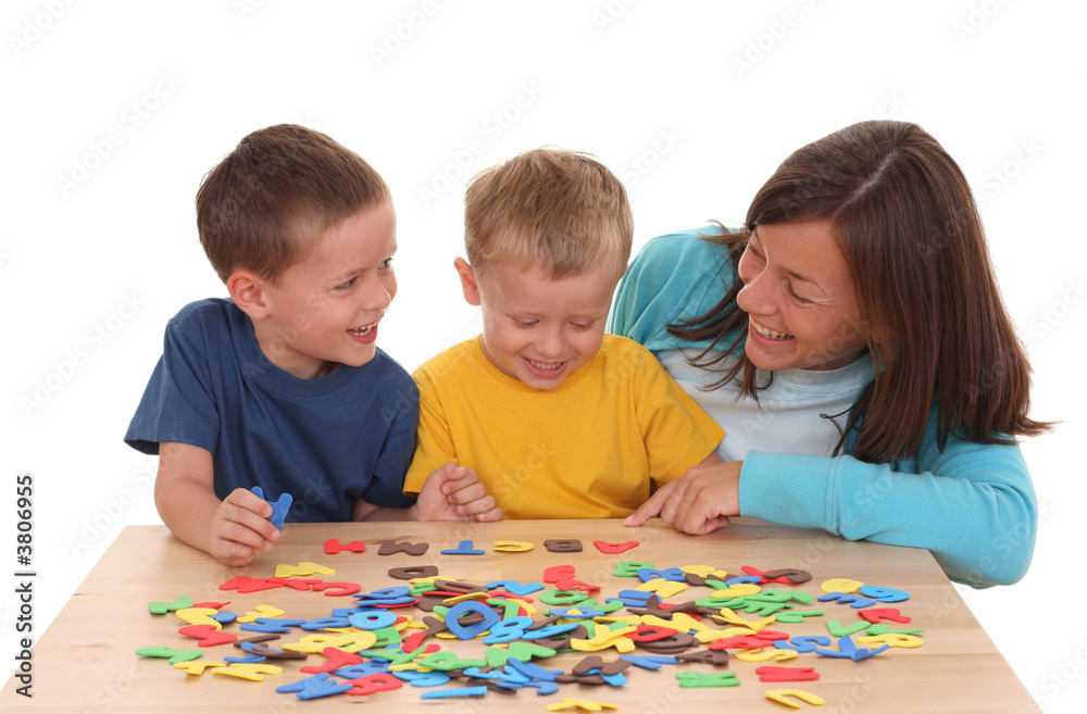children and mother playing with letters isolated on white children and mother playing with letters isolated on white