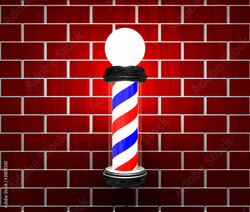 Barber pole on brick wall