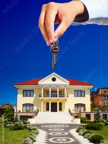 House owner/real estate agent giving away the keys