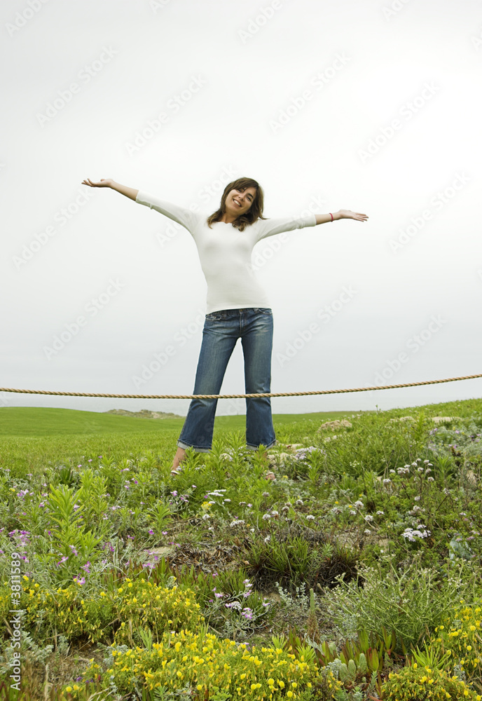 Happy woman with opean arms on a green landscape Happy woman with opean arms on a green landscape