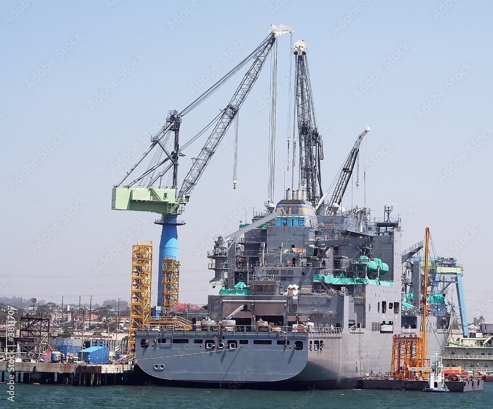 A military ship docked in the shipyard getting upgraded A military ship docked in the shipyard getting upgraded