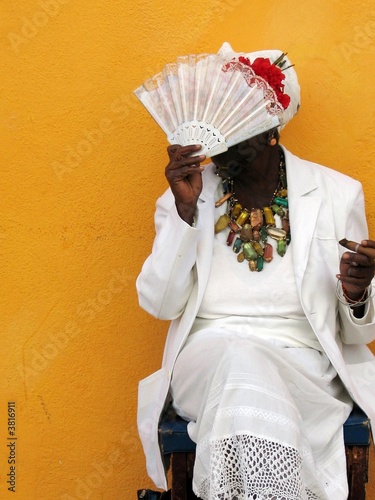 Photography Portrait of senior afroamerican woman with cigar