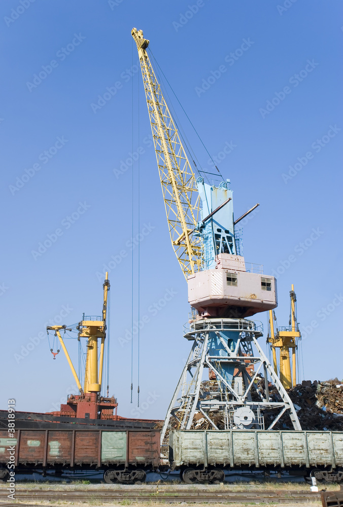 The elevating crane costing on loading of cars on a railway way The elevating crane costing on loading of cars on a railway way