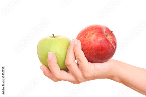 red and green apple in hand on white