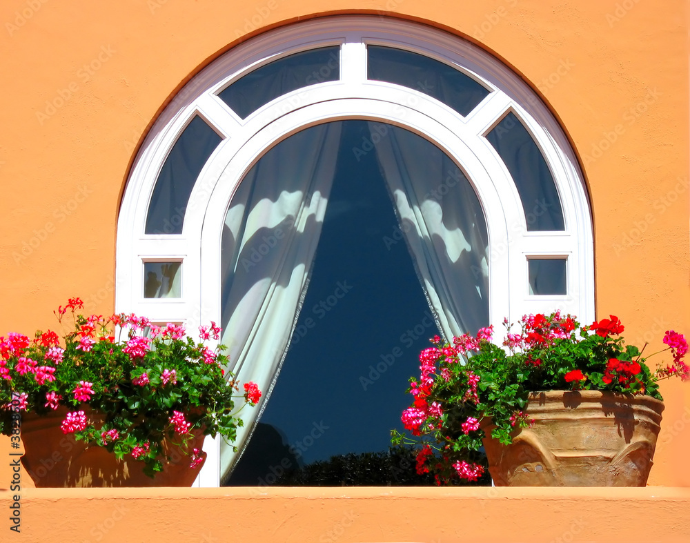 Nice window decorated with flowers