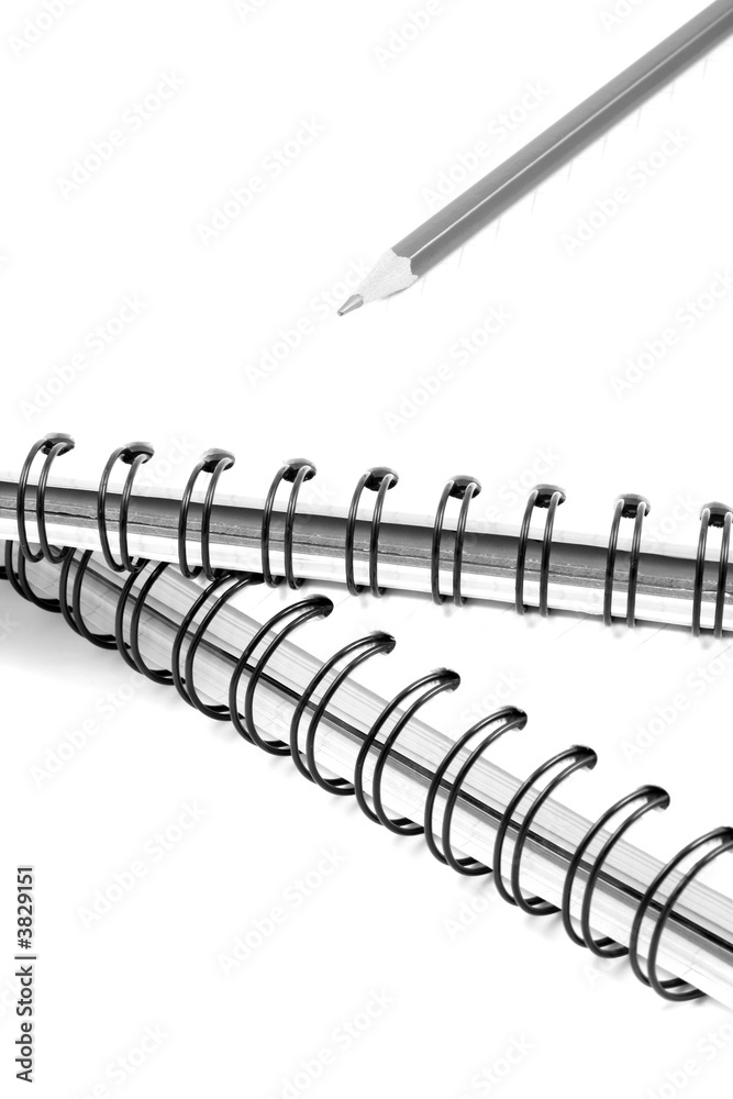 two spiral books and pencil isolated on white two spiral books and pencil isolated on white