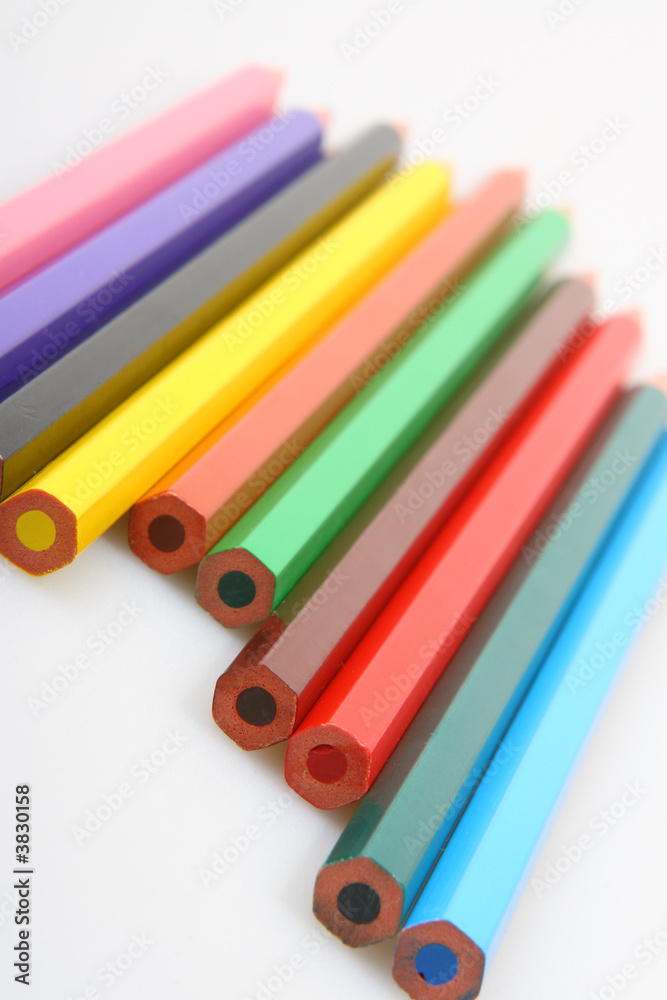 Some color pencils in a row on white background Some color pencils in a row on white background