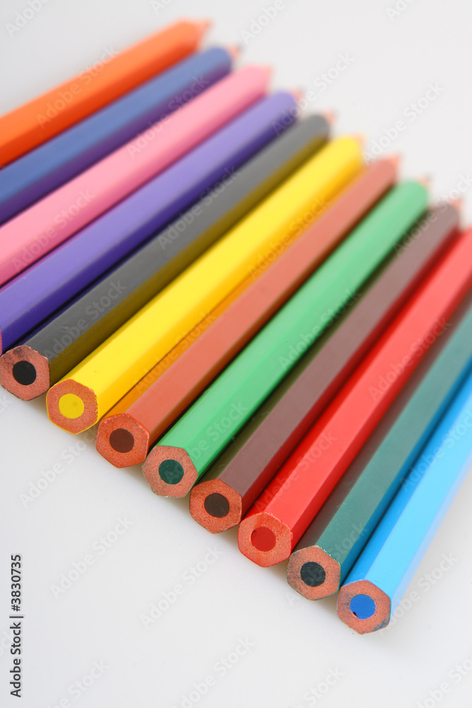 Some color pencils in a row on white background Some color pencils in a row on white background