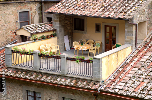 A pretty patio with chairs and table in Tuscany, Italy.