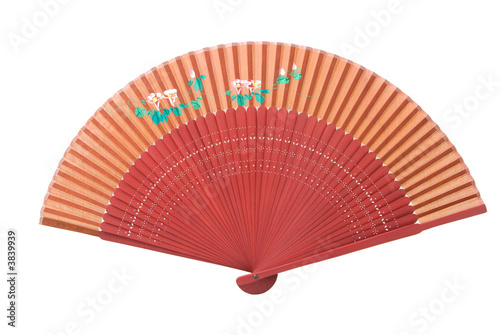 A red Asian fan wit a flower pattern  isolated on white.