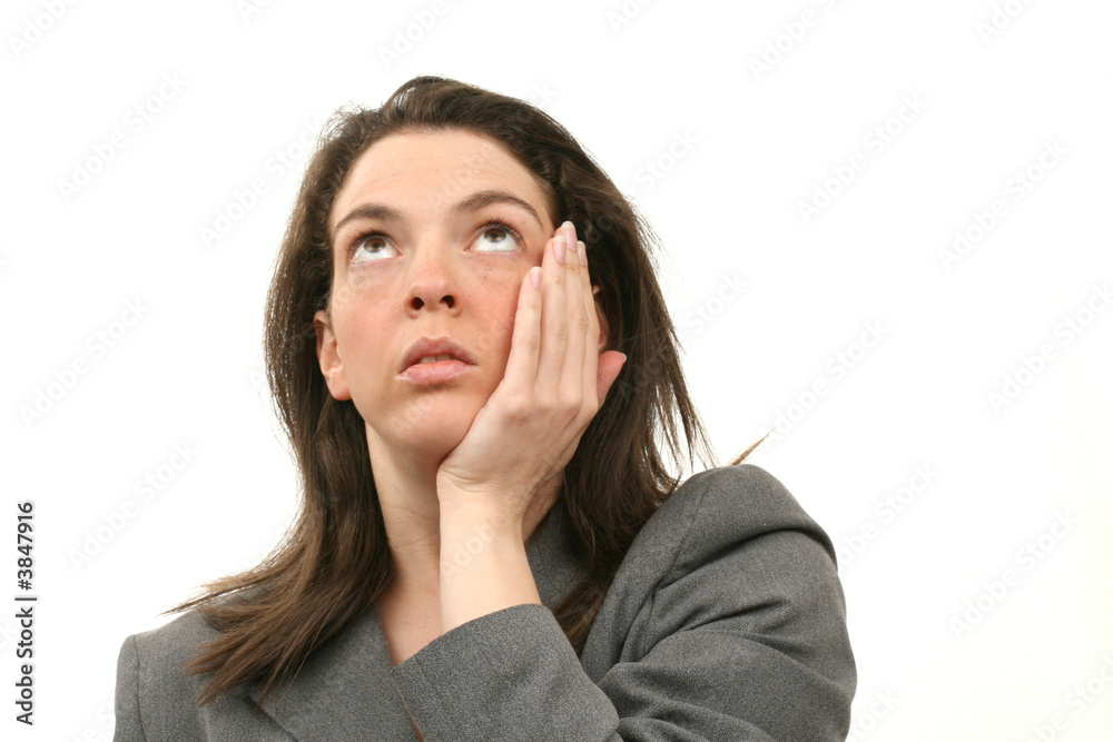 Worried business woman in a suit isolated over white background Worried business woman in a suit isolated over white background