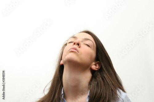 Young woman isolated over white background with eyes closed