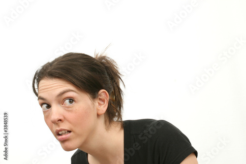 Cowering young woman isolated over white background