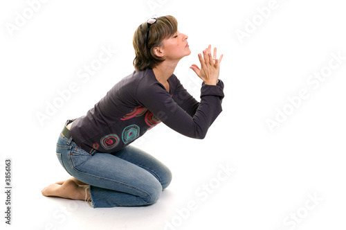 young women praying on her knees