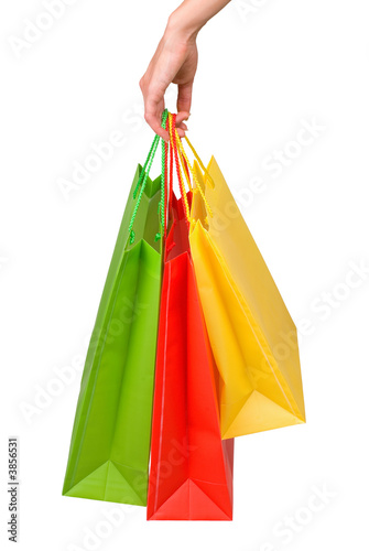 Female hand with packages on a white background