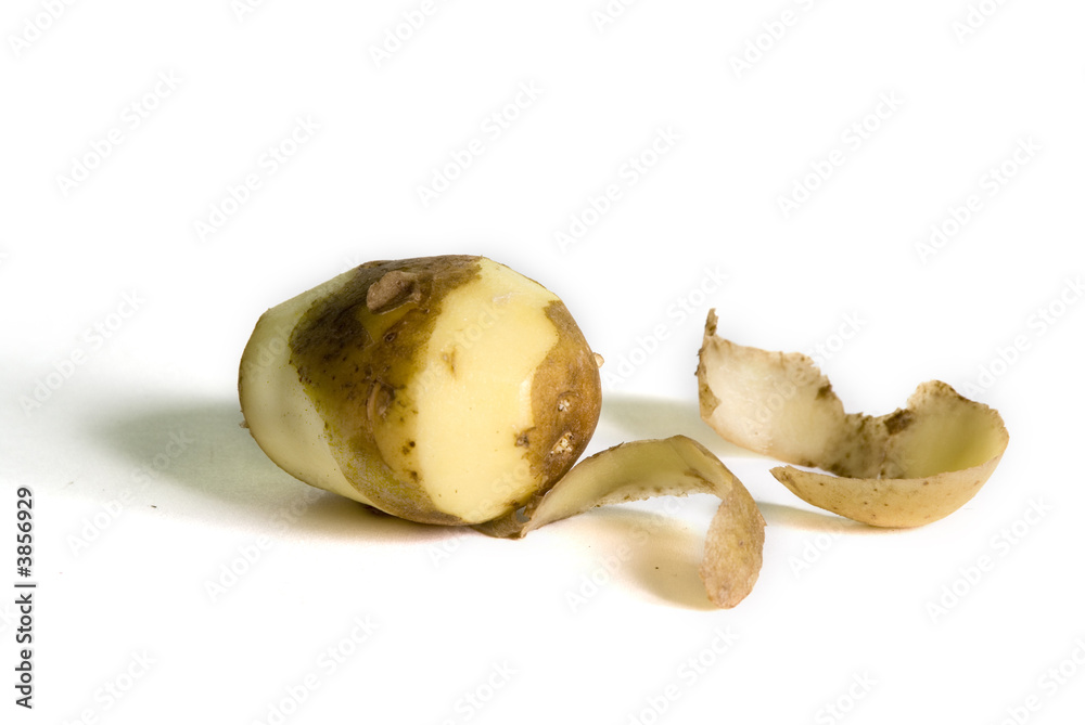 One patato half without his skin One patato half without his skin