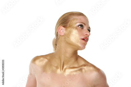 Sexy blond woman in gold makeup
