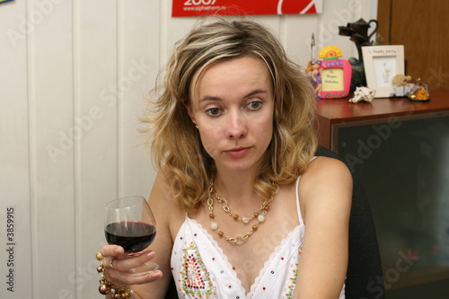 Photography The woman in a white dress holds in a hand a wine glass