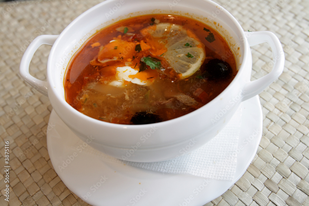 Russian solyanka - spicy soup of vegetables and meat with lemon Russian solyanka - spicy soup of vegetables and meat with lemon
