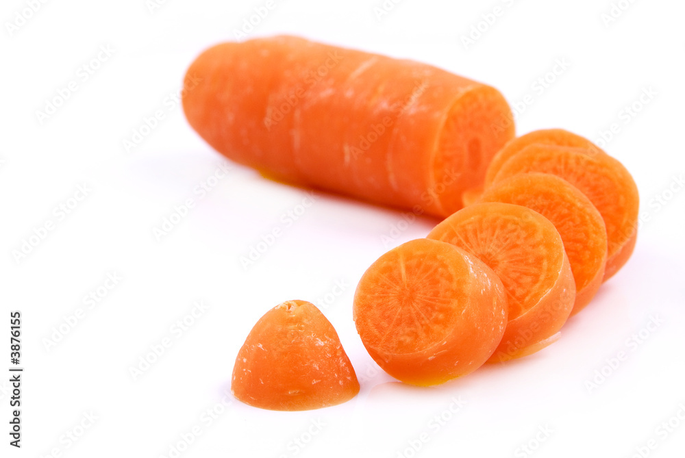 Chopped up Carrot in small slices on white background Chopped up Carrot in small slices on white background