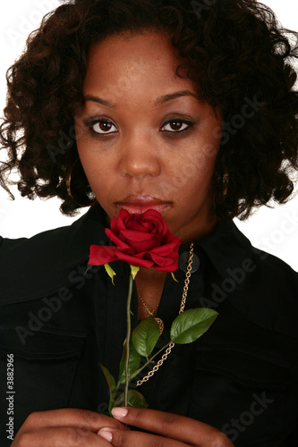 African American Girl Smelling Rose