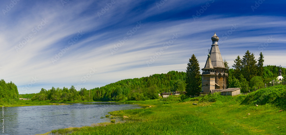 Naklejka premium Church on coast of the river