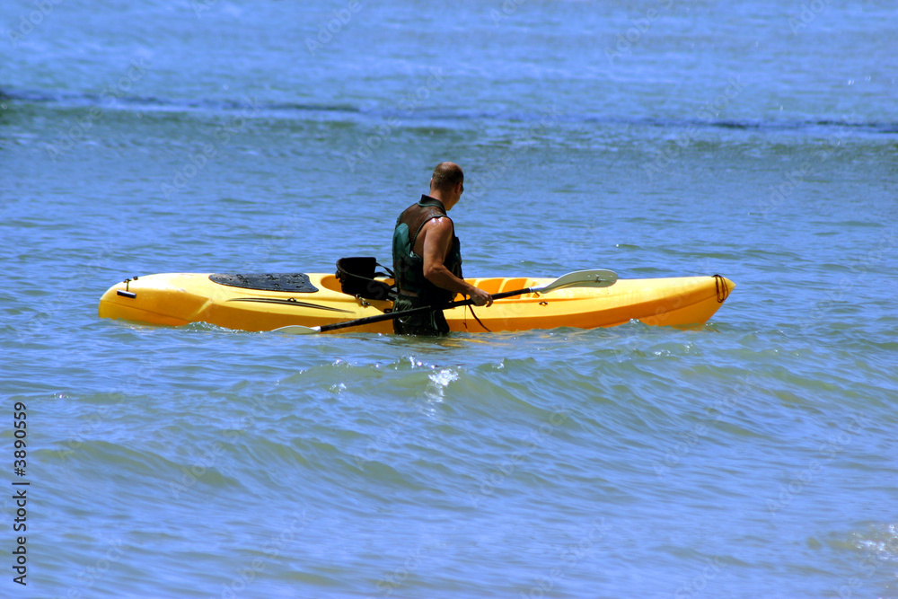 Man kayaking on his vacation in California