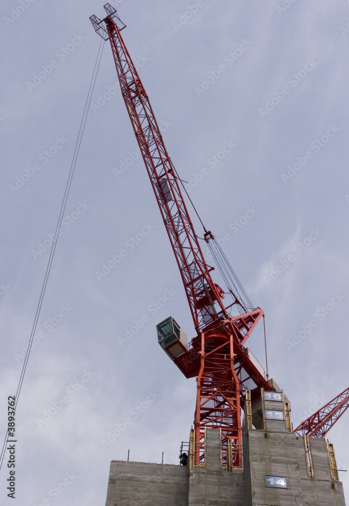 Construction crane on top of building