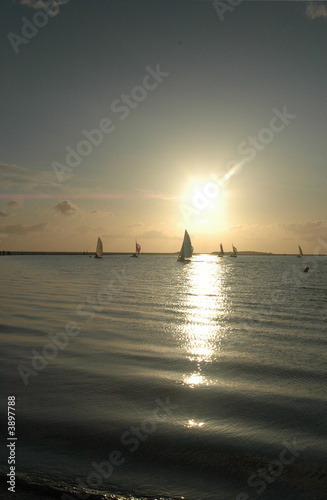 Sailing through a sunset