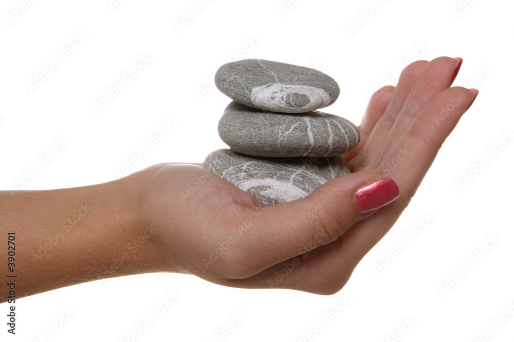 Hand and stones isolated on white background Hand and stones isolated on white background