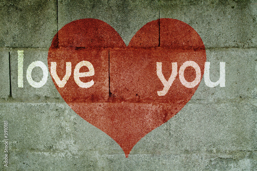 inscription on wall I love you with red heart