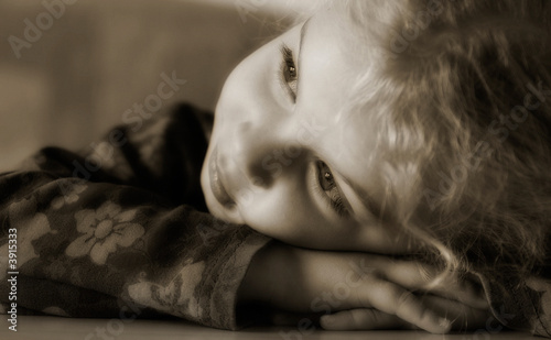 a little girl lost in her thoughts