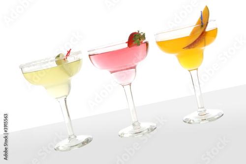 Three colorful cocktails over a white background