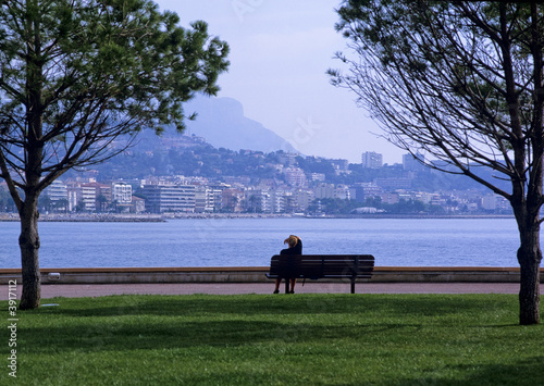 woman on bench looking at view menton  alpes maritime  photo