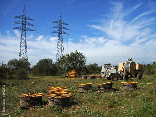 Power line installation works in the fields photo