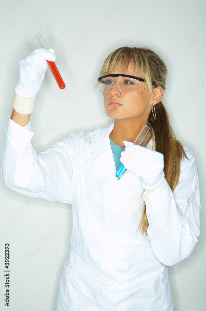 Beautiful female lab worker testing and experimenting Beautiful female lab worker testing and experimenting