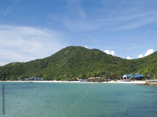 Beach on a tropical island with dense forest behind