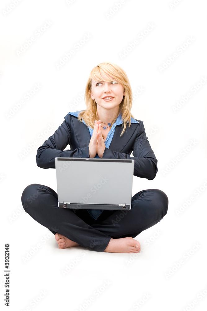 Shoeless woman with laptop do meditative exercises Shoeless woman with laptop do meditative exercises