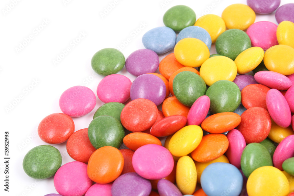 pile of colorful candies isolated on white pile of colorful candies isolated on white