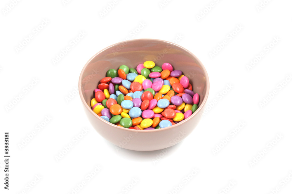 bowl of colorful candies isolated on white