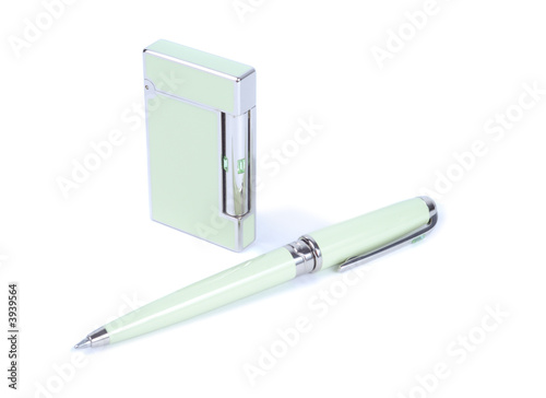 Cigarette ligter and pen isolated over white background photo