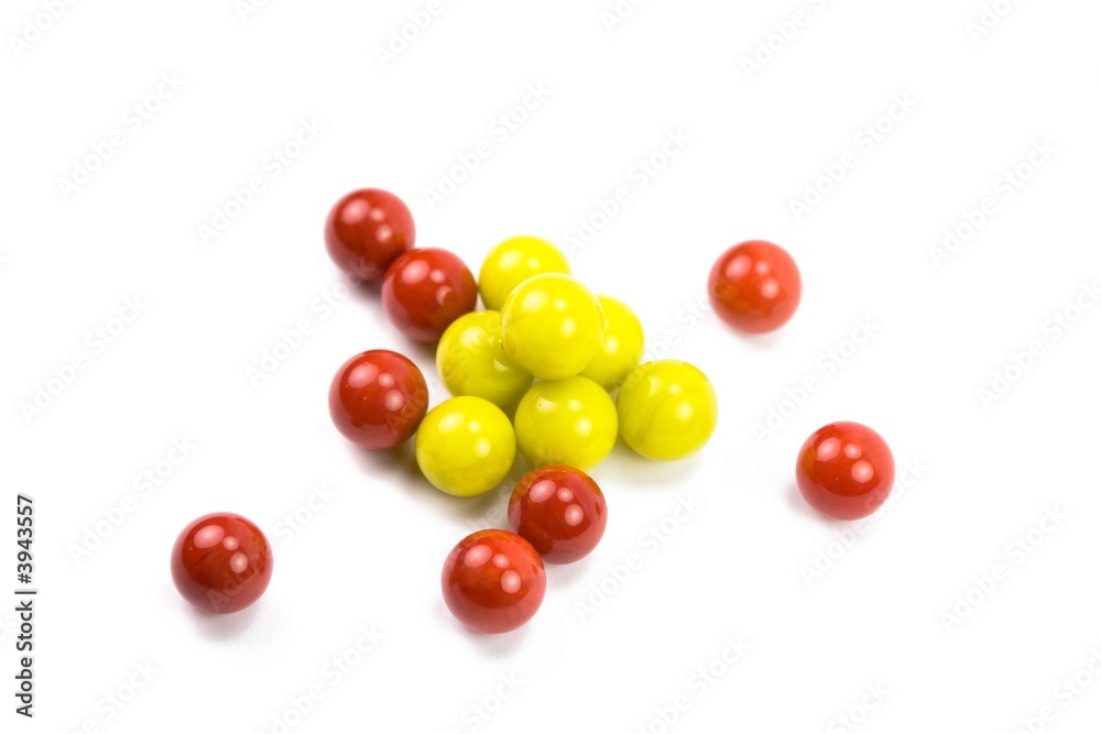 A bunch of marbles chaotically on white A bunch of marbles chaotically on white