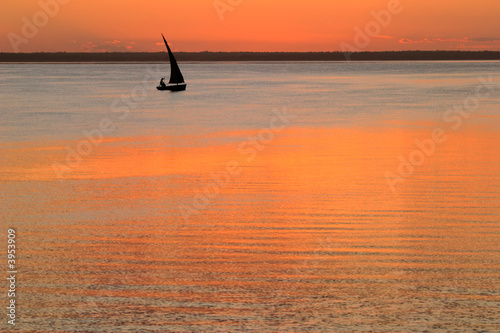 Beach sunset with boat (mozambique)