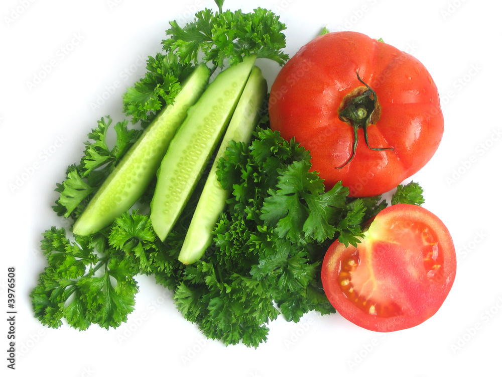 Cucumbers, tomatoes and greens, close up