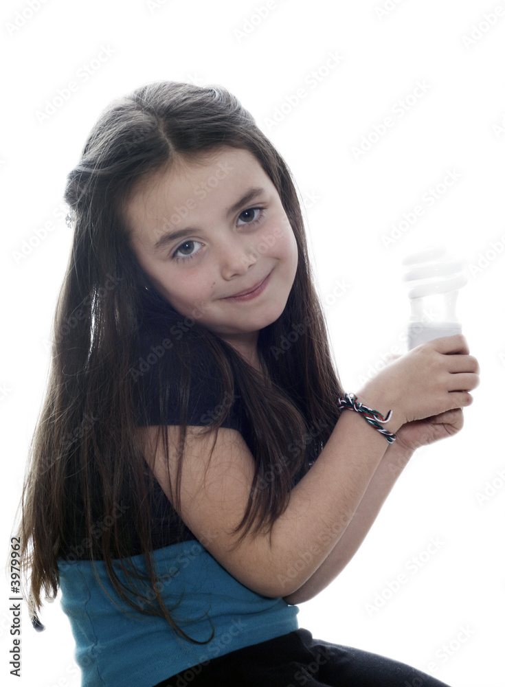 Young girl with an energy saver light globe Young girl with an energy saver light globe
