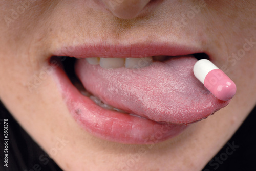 Pink pill on tongue
