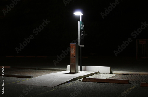 Parking lot pay station at night