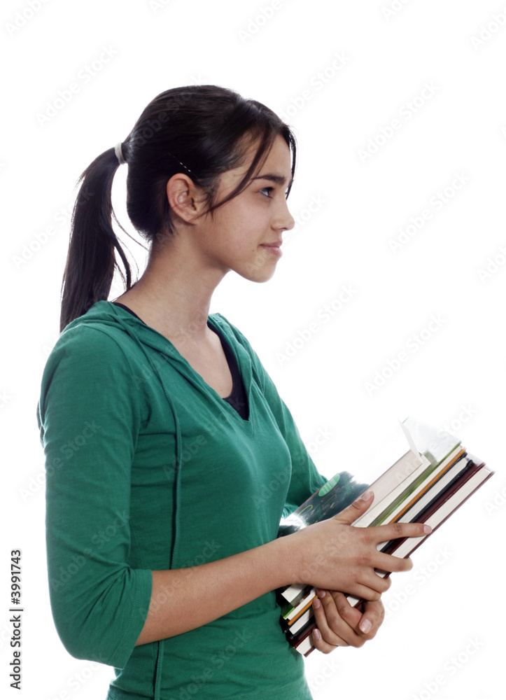 Female university student smiling and carrying some notebooks Female university student smiling and carrying some notebooks