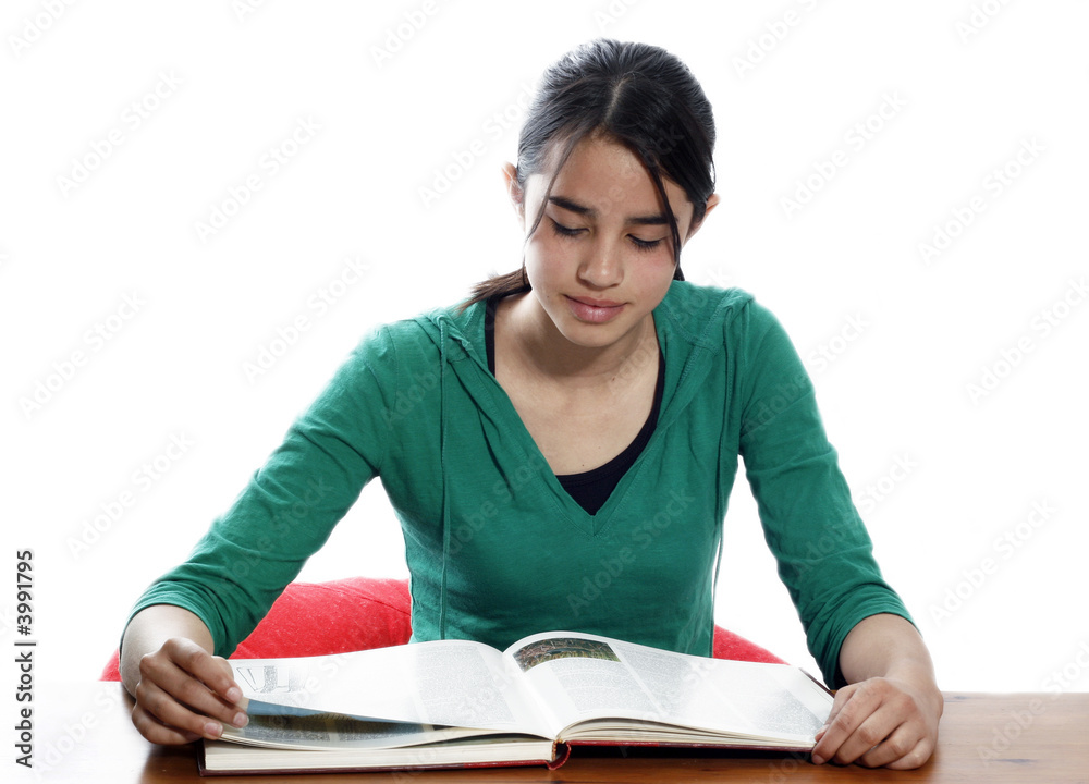 A young woman reading in the library A young woman reading in the library