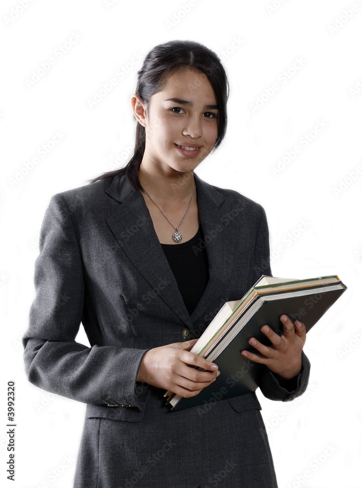 Female university student smiling and carrying some notebooks Female university student smiling and carrying some notebooks